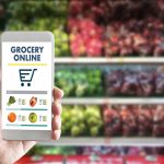 holding a phone up in a grocery store