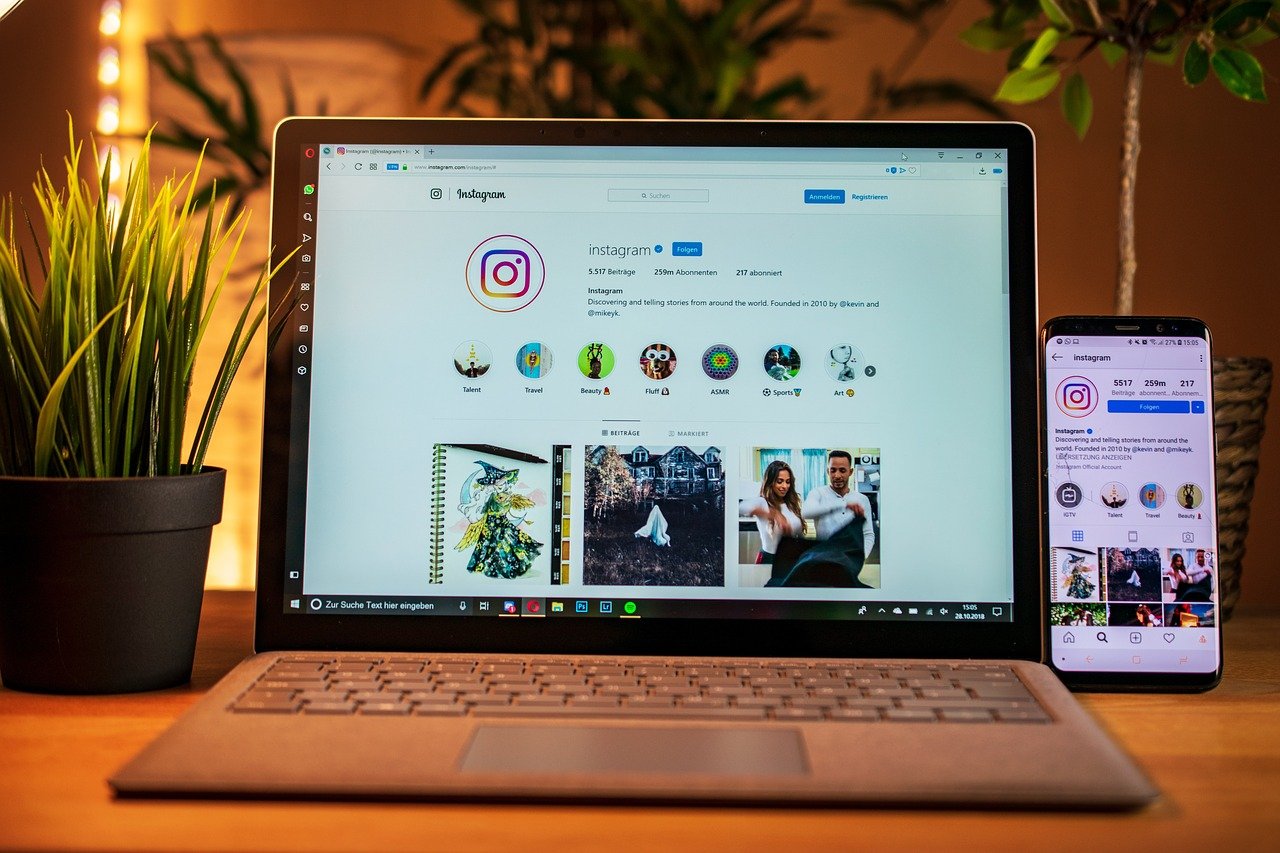 Instagram on a laptop and phone